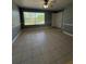 Bright and airy living room with a large window, ceramic tile, and a ceiling fan at 4772 Walden Cir # 228, Orlando, FL 32811