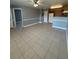 An open-concept kitchen and living room perfect for gatherings at 4772 Walden Cir # 228, Orlando, FL 32811