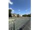 Tennis court ready for play with nice complex in background at 4772 Walden Cir # 228, Orlando, FL 32811
