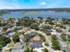 Scenic aerial showcases a quiet, residential area with lush landscaping and proximity to a sprawling lake at 5100 La Croix Ave, Belle Isle, FL 32812