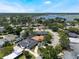 Aerial view of homes located near tranquil lake offers peaceful suburban living with city views at 5100 La Croix Ave, Belle Isle, FL 32812
