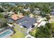 Aerial view of the home featuring a screened-in pool, boat parking, lush landscaping, and neighborhood at 5100 La Croix Ave, Belle Isle, FL 32812