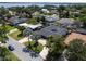Beautiful aerial shot features well-maintained homes, mature trees, and glimpses of a sparkling lake nearby at 5100 La Croix Ave, Belle Isle, FL 32812