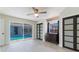 Bedroom with sliding doors to the pool area and a dresser with stylish decor at 5100 La Croix Ave, Belle Isle, FL 32812