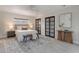 Cozy bedroom showcasing soft furnishings, a decorative rug, and modern closet doors at 5100 La Croix Ave, Belle Isle, FL 32812
