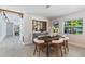 Dining room with stylish chairs, wood table, and built-in bar area at 5100 La Croix Ave, Belle Isle, FL 32812
