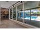 Hallway view to the screened in pool with a spacious patio and outdoor seating at 5100 La Croix Ave, Belle Isle, FL 32812