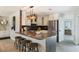 Stylish kitchen with modern appliances, breakfast bar, and elegant pendant lighting at 5100 La Croix Ave, Belle Isle, FL 32812