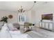 Well-lit living room with modern furniture, stylish decor, and entertainment center at 5100 La Croix Ave, Belle Isle, FL 32812