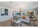 Open-concept living room with a comfortable sofa, stylish decor, and view to the kitchen at 5100 La Croix Ave, Belle Isle, FL 32812