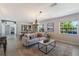 Bright living space featuring a modern sofa and views of the outdoor scenery at 5100 La Croix Ave, Belle Isle, FL 32812