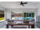 Bright office space with ceiling fan, desk, and chairs with views of pool at 5100 La Croix Ave, Belle Isle, FL 32812