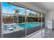 A covered pool with a luxurious patio and seating perfect for entertaining at 5100 La Croix Ave, Belle Isle, FL 32812
