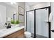 Bathroom featuring white marbled countertop, framed artwork, and a modern glass enclosed shower at 5156 Gardenrow Dr, St Cloud, FL 34772