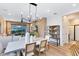 Open dining and living space with modern finishes, leading into the well-equipped kitchen with stainless steel appliances at 5156 Gardenrow Dr, St Cloud, FL 34772