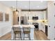 Stylish kitchen featuring stainless steel appliances, a center island with seating, and elegant pendant lighting at 5156 Gardenrow Dr, St Cloud, FL 34772
