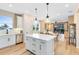 Beautiful kitchen with a large center island, stainless steel appliances, and an open layout to the living area at 5156 Gardenrow Dr, St Cloud, FL 34772