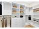Organized walk-in closet with shelving, drawers, and hanging rods for ample storage at 5156 Gardenrow Dr, St Cloud, FL 34772