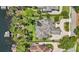 Stunning lakefront property featuring a swimming pool, lush greenery, and a serene backdrop at 5550 Osprey Isle Ln, Orlando, FL 32819
