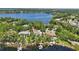 Waterfront community showcasing backyard boat docks and lush trees creating a picturesque landscape at 5550 Osprey Isle Ln, Orlando, FL 32819