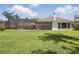 A lush backyard with a screened-in pool and patio area at 5550 Osprey Isle Ln, Orlando, FL 32819