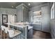 Modern bar area featuring sleek countertops, elegant cabinetry, and stylish seating perfect for entertaining and socializing at 5550 Osprey Isle Ln, Orlando, FL 32819