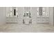 Spacious bathroom features dual vanities, marble countertops, and designer lighting at 5550 Osprey Isle Ln, Orlando, FL 32819