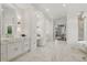 Spacious primary bathroom with vanity, marble countertops, and designer lighting at 5550 Osprey Isle Ln, Orlando, FL 32819