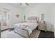 Comfortable bedroom features a queen-sized bed, bedside tables, and a glass-paneled door to the outside at 5550 Osprey Isle Ln, Orlando, FL 32819