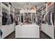 Large walk-in closet with custom shelving, display cabinets, and central island at 5550 Osprey Isle Ln, Orlando, FL 32819