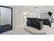 Enjoy this home theater with comfortable black leather seating and a large screen for the ultimate viewing experience at 5550 Osprey Isle Ln, Orlando, FL 32819
