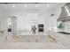 Elegant white kitchen with marble countertops, custom cabinetry, and stainless steel appliances at 5550 Osprey Isle Ln, Orlando, FL 32819