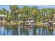 Lakefront property featuring a covered boat dock, providing easy access to the water at 5550 Osprey Isle Ln, Orlando, FL 32819