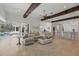 Open-concept living area showcasing a comfortable sectional sofa and sliding glass doors leading to a private pool and patio at 5550 Osprey Isle Ln, Orlando, FL 32819