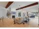 Comfortable living room with a fireplace, ceiling fan, and a view of the backyard at 5550 Osprey Isle Ln, Orlando, FL 32819