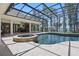 Inviting pool area with hot tub, sun loungers, and lush landscaping at 5550 Osprey Isle Ln, Orlando, FL 32819