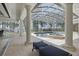 Gorgeous pool patio with enclosed screen, luxurious lounge chairs, and outdoor living spaces at 5550 Osprey Isle Ln, Orlando, FL 32819