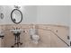 Charming powder room features a unique sink, patterned tile, and decorative accents at 5550 Osprey Isle Ln, Orlando, FL 32819