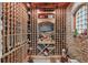 Climate-controlled wine cellar featuring custom racking and brick accents offering an exquisite storage solution for wine enthusiasts at 5550 Osprey Isle Ln, Orlando, FL 32819