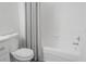 Bathroom features white subway tile in the tub surround and a white vanity with stone countertop at 5953 Westgate Dr # 1823, Orlando, FL 32835