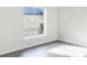 Sunlit bedroom showcasing a large window that looks out over a courtyard and neighboring building at 5953 Westgate Dr # 1823, Orlando, FL 32835