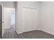 A bright bedroom space with a closet and a door leading to the bathroom at 5953 Westgate Dr # 1823, Orlando, FL 32835