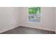 Well-lit bedroom showcasing a window with views of the neighborhood and ample natural light at 5953 Westgate Dr # 1823, Orlando, FL 32835
