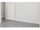 A clean and simple bedroom space featuring a closet and sleek flooring at 5953 Westgate Dr # 1823, Orlando, FL 32835