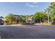 Community center with fountain, mature trees, and well-maintained landscaping at 5953 Westgate Dr # 1823, Orlando, FL 32835