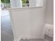 Bright hallway with light gray wood floors and a view to windows with trees at 5953 Westgate Dr # 1823, Orlando, FL 32835