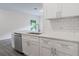 Well-lit kitchen with white cabinets, stainless steel appliances, and modern subway tile backsplash at 5953 Westgate Dr # 1823, Orlando, FL 32835