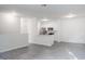 A spacious living room with sleek flooring provides an open concept feel, leading to the kitchen at 5953 Westgate Dr # 1823, Orlando, FL 32835