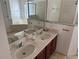 Bathroom with double sink vanity, soaking tub, and separate shower at 708 Pincon Ln, Kissimmee, FL 34759