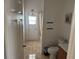 Full bathroom with a shower-tub combo, tile flooring, and ample space at 708 Pincon Ln, Kissimmee, FL 34759